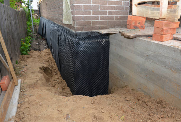 Happy homeowners after waterproofing job in Elkton